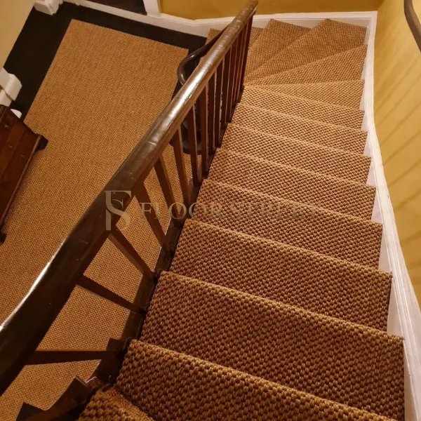 Woven sisal runner with dark border on staircase