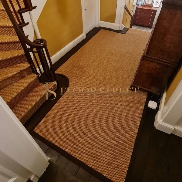 Woven sisal stair runner with dark binding