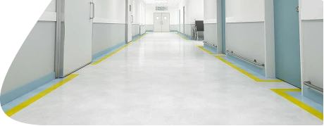 Hospital flooring featuring smooth, light grey seamless vinyl