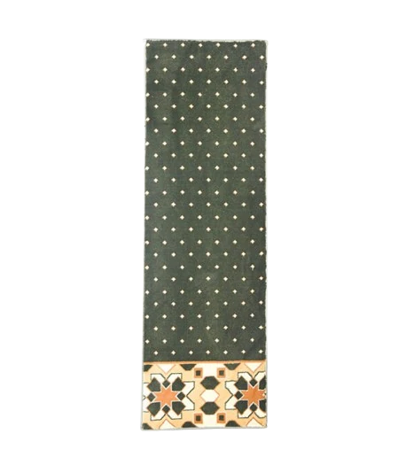 Green mosque carpet with diamond pattern and geometric border.