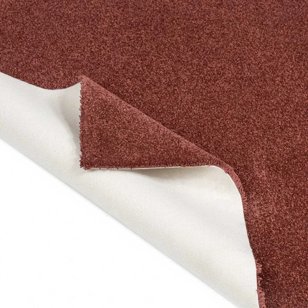 Red carpet sample showing white felt backing